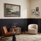 Black slat wainscoting panels installed as half-wall paneling in a styled interior