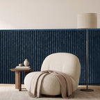 Blue slat wainscoting panels installed as half-wall paneling in a styled interior