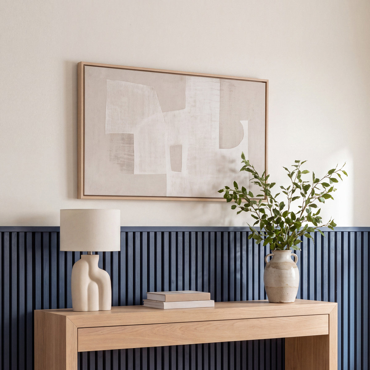 Blue wainscoting panels running along a bedroom wall with coordinating top molding