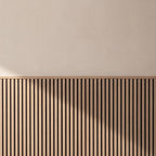 Oak acoustic wainscot panels as a half-wall accent behind furniture in a living space