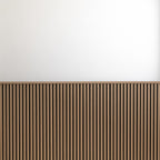 Oak wainscot slat panels finished with top molding against a white upper wall