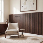 Walnut slat wainscoting panels installed as half-wall paneling in a styled interior