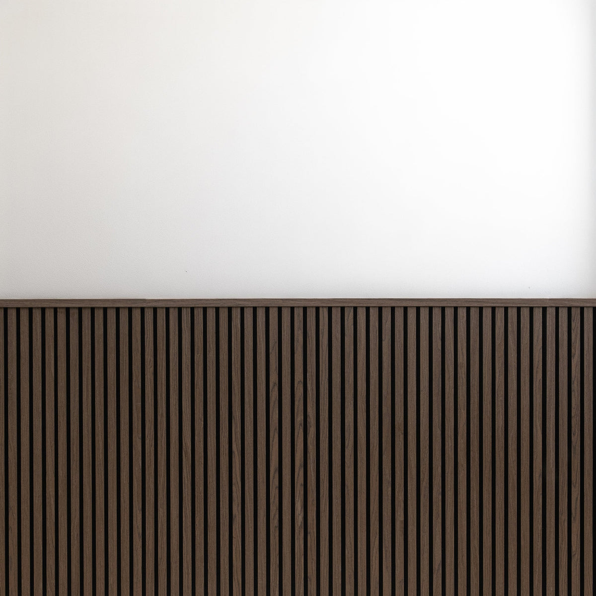 Close-up of the walnut wood-grain slat texture on ZETY wainscoting panels