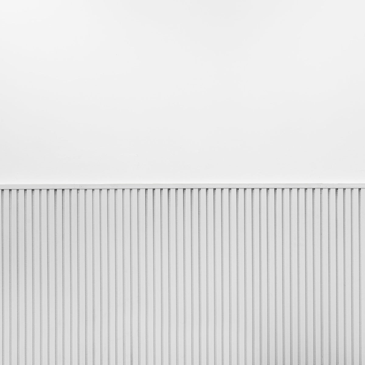 Close-up of the white slat texture on ZETY wainscoting panels