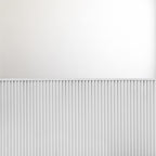 White wainscot slat panels finished with top molding against a painted upper wall