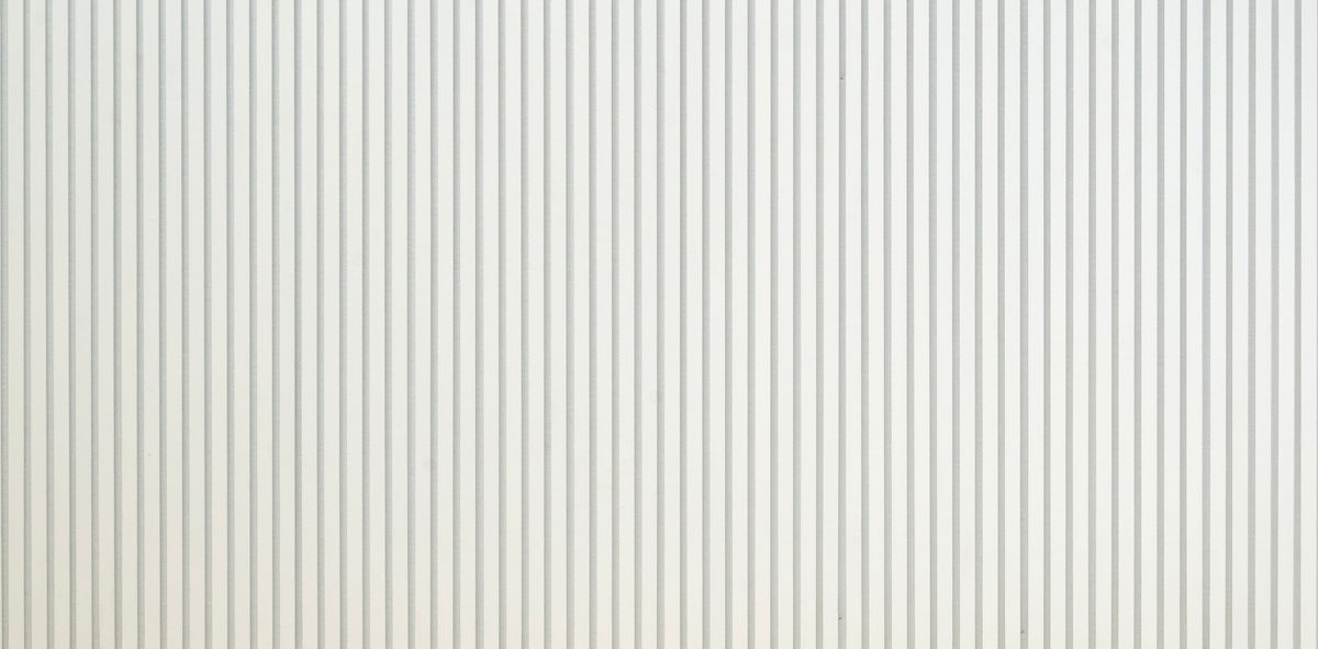 Wide detail of white slat wall panel surface and slat spacing, ZETY