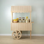 Wood-look candy cart with canopy, counter and spoked wheels styled with candy jars