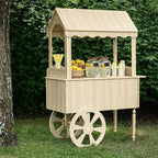 Wood-look candy cart set up outdoors on grass, front view with canopy and valance