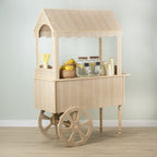 Front angle of the wood-look candy cart with dessert display on the counter