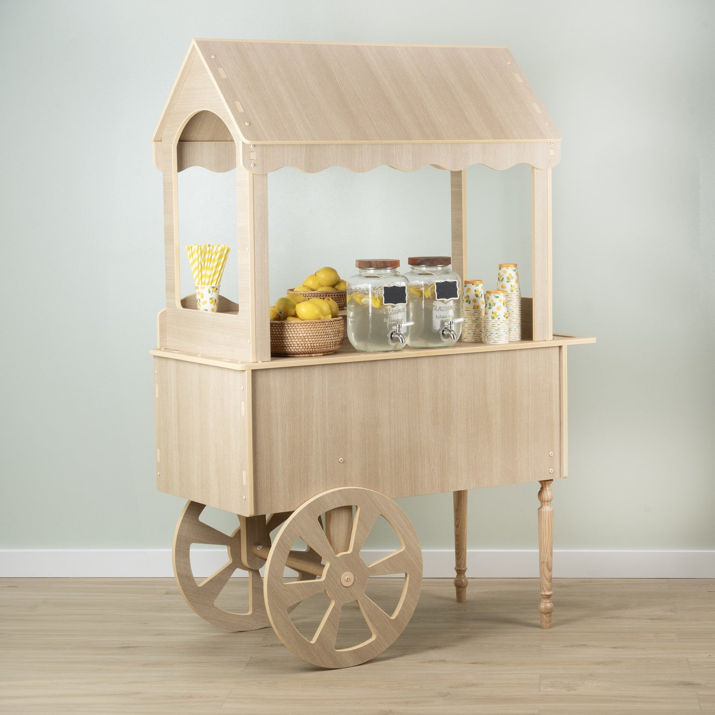 Front angle of the wood candy cart with dessert display on the counter