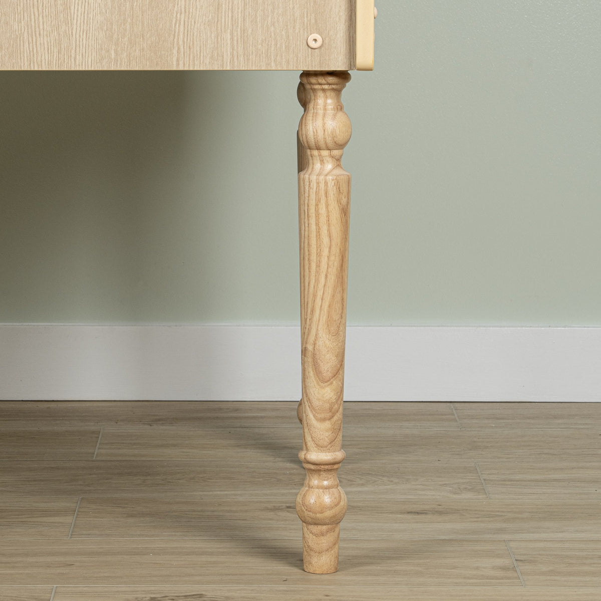 Detail of the turned rear leg and the wood-look PVC finish