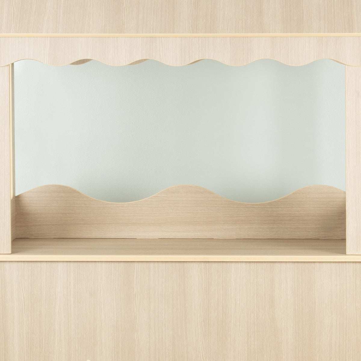 Scalloped canopy valance on the wood-look candy cart